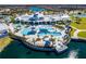 Beautiful aerial view of a community pool, clubhouse, and scenic water feature at 5670 Shorebird Br, Land O Lakes, FL 34638
