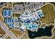 Aerial view showcasing community amenities, including a pool, tennis courts, bocce ball, clubhouse, and parking at 5670 Shorebird Br, Land O Lakes, FL 34638