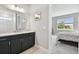 Bathroom with a spacious countertop and ample storage space at 5670 Shorebird Br, Land O Lakes, FL 34638
