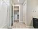 Bright bathroom featuring a bathtub, walk-in closet, and wood-look tile flooring, creating a spa-like ambiance at 5670 Shorebird Br, Land O Lakes, FL 34638