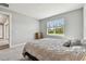 Cozy bedroom with view to the backyard featuring an outdoor landscape view at 5670 Shorebird Br, Land O Lakes, FL 34638
