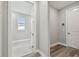 Hallway featuring gray wood-look flooring and a view into another room at 5670 Shorebird Br, Land O Lakes, FL 34638