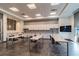 Bright kitchenette featuring sleek white cabinetry, countertops, stainless steel sinks, and tile flooring at 5670 Shorebird Br, Land O Lakes, FL 34638