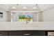 Bright living room showcasing an open floor plan, a large window view, and neutral colors at 5670 Shorebird Br, Land O Lakes, FL 34638