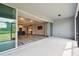 Screened in lanai showing large living space with luxury vinyl plank flooring and a modern open floor plan at 5670 Shorebird Br, Land O Lakes, FL 34638
