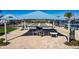 Shaded community recreation area with bocce ball courts, seating, and well-maintained landscaping at 5670 Shorebird Br, Land O Lakes, FL 34638