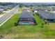 Aerial shot displays a home with a screened-in pool and a beautifully landscaped backyard at 5828 Clairwood Ct, Palmetto, FL 34221