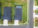Aerial view of a single-story home featuring a dark roof and a backyard pool surrounded by lush green landscaping at 5828 Clairwood Ct, Palmetto, FL 34221
