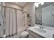 Bathroom featuring a tub with shower, single vanity, toilet, and decor at 5828 Clairwood Ct, Palmetto, FL 34221