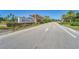 Artisan Lakes community entrance sign with palm trees and landscaping at 5828 Clairwood Ct, Palmetto, FL 34221