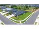 Charming single-story home featuring a landscaped front yard with a side entry two-car garage and screened-in lanai at 5828 Clairwood Ct, Palmetto, FL 34221