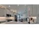 Open-concept kitchen features bright white countertops, stainless steel appliances and sink area that overlooks the dining room at 5828 Clairwood Ct, Palmetto, FL 34221