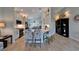 Bright and airy kitchen features breakfast bar seating, ample storage, and an open design with views of the dining room at 5828 Clairwood Ct, Palmetto, FL 34221