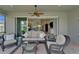 Inviting covered patio with comfortable seating, ideal for relaxing and enjoying the outdoors at 5828 Clairwood Ct, Palmetto, FL 34221