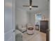 Cozy sitting room with light walls, comfortable seating, and a ceiling fan for added comfort at 5828 Clairwood Ct, Palmetto, FL 34221