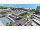 Aerial view of community including a clubhouse and outdoor pool and water views at 5925 Shore S Blvd # 602, Gulfport, FL 33707