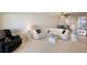 Bright living room with plush seating, and a view into the dining area at 5925 Shore S Blvd # 602, Gulfport, FL 33707