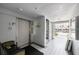 Elevator lobby with white brick walls, tiled flooring and seating area at 5925 Shore S Blvd # 602, Gulfport, FL 33707