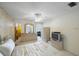 Sunny main bedroom featuring an ensuite bathroom and bright balcony with water views at 5925 Shore S Blvd # 602, Gulfport, FL 33707