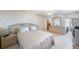 Bright main bedroom featuring an ensuite bathroom and balcony access with water views at 5925 Shore S Blvd # 602, Gulfport, FL 33707