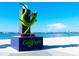 Statue of a lizard with sunglasses riding a skateboard on the waterfront at 5925 Shore S Blvd # 602, Gulfport, FL 33707