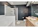 Modern bathroom with a glass-enclosed shower, soaking tub, and stylish vanity, creating a spa-like experience at 6233 Olivedale Dr, Riverview, FL 33578