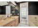 Elegant bathroom with dual sinks, stylish lighting, and a view into the bedroom at 6233 Olivedale Dr, Riverview, FL 33578