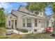 Charming house with a covered porch, landscaped garden, and a one car garage at 6233 Olivedale Dr, Riverview, FL 33578