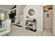 Foyer with a modern mirror and black table, with open stairway to the living area at 6233 Olivedale Dr, Riverview, FL 33578