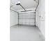 Attached garage featuring a functional white paneled garage door with electric door opener at 6233 Olivedale Dr, Riverview, FL 33578