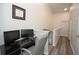Upstairs home office featuring a modern desk, dual monitors, and natural light at 6233 Olivedale Dr, Riverview, FL 33578