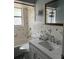 Bathroom showcasing white tile, modern fixtures, and a shower/tub combo at 627 E Davis Blvd, Tampa, FL 33606