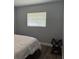 Bedroom featuring a window with natural light and contemporary decor at 627 E Davis Blvd, Tampa, FL 33606