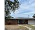 Charming single-story brick home with a well-maintained lawn and inviting front entrance at 627 E Davis Blvd, Tampa, FL 33606