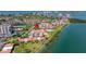 Scenic aerial view of the waterfront condominium complex with lush landscaping, pool and bay views at 6295 Bahia Del Mar Cir # 406, St Petersburg, FL 33715