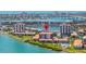 Scenic aerial view featuring a waterfront property with pool, luscious greenery and water views at 6295 Bahia Del Mar Cir # 406, St Petersburg, FL 33715