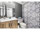 Bathroom features a single sink vanity and a shower with blue patterned shower curtain at 6295 Bahia Del Mar Cir # 406, St Petersburg, FL 33715
