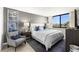 Comfortable bedroom featuring a large window with a view, a queen bed and calming decor at 6295 Bahia Del Mar Cir # 406, St Petersburg, FL 33715