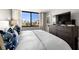 Bedroom with a large window, palm tree view, and comfortable decor at 6295 Bahia Del Mar Cir # 406, St Petersburg, FL 33715