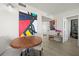 Inviting dining area with modern decor, artwork, and access to other living spaces at 6295 Bahia Del Mar Cir # 406, St Petersburg, FL 33715