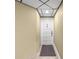 Neutral-toned entryway featuring a door with unit number and tiled floors for a clean and welcoming entrance at 6295 Bahia Del Mar Cir # 406, St Petersburg, FL 33715