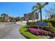 Exterior view of building entrance with manicured landscaping, signage, and convenient ramp access at 6295 Bahia Del Mar Cir # 406, St Petersburg, FL 33715