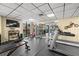 Fully equipped gym with machines, weights, and a mounted television at 6295 Bahia Del Mar Cir # 406, St Petersburg, FL 33715