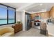 Bright kitchen with stainless steel appliances, wood cabinets, and a water view at 6295 Bahia Del Mar Cir # 406, St Petersburg, FL 33715