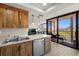 Kitchen with stainless dishwasher and an opening onto a balcony and living room at 6295 Bahia Del Mar Cir # 406, St Petersburg, FL 33715