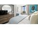This primary suite has a beautiful view of the harbor, luxury bed and stylish decor at 6295 Bahia Del Mar Cir # 406, St Petersburg, FL 33715