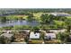 Aerial view of the property near a lake, park with baseball field, and other community amenities at 6415 13Th N Ave, St Petersburg, FL 33710