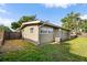 Well-manicured backyard showcasing the home's exterior and a neatly kept lawn at 6415 13Th N Ave, St Petersburg, FL 33710