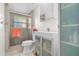 Modern bathroom featuring a sleek vanity and walk-in shower with glass door at 6415 13Th N Ave, St Petersburg, FL 33710