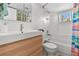 Bright bathroom featuring sleek fixtures, a tub with shower, and natural light at 6415 13Th N Ave, St Petersburg, FL 33710